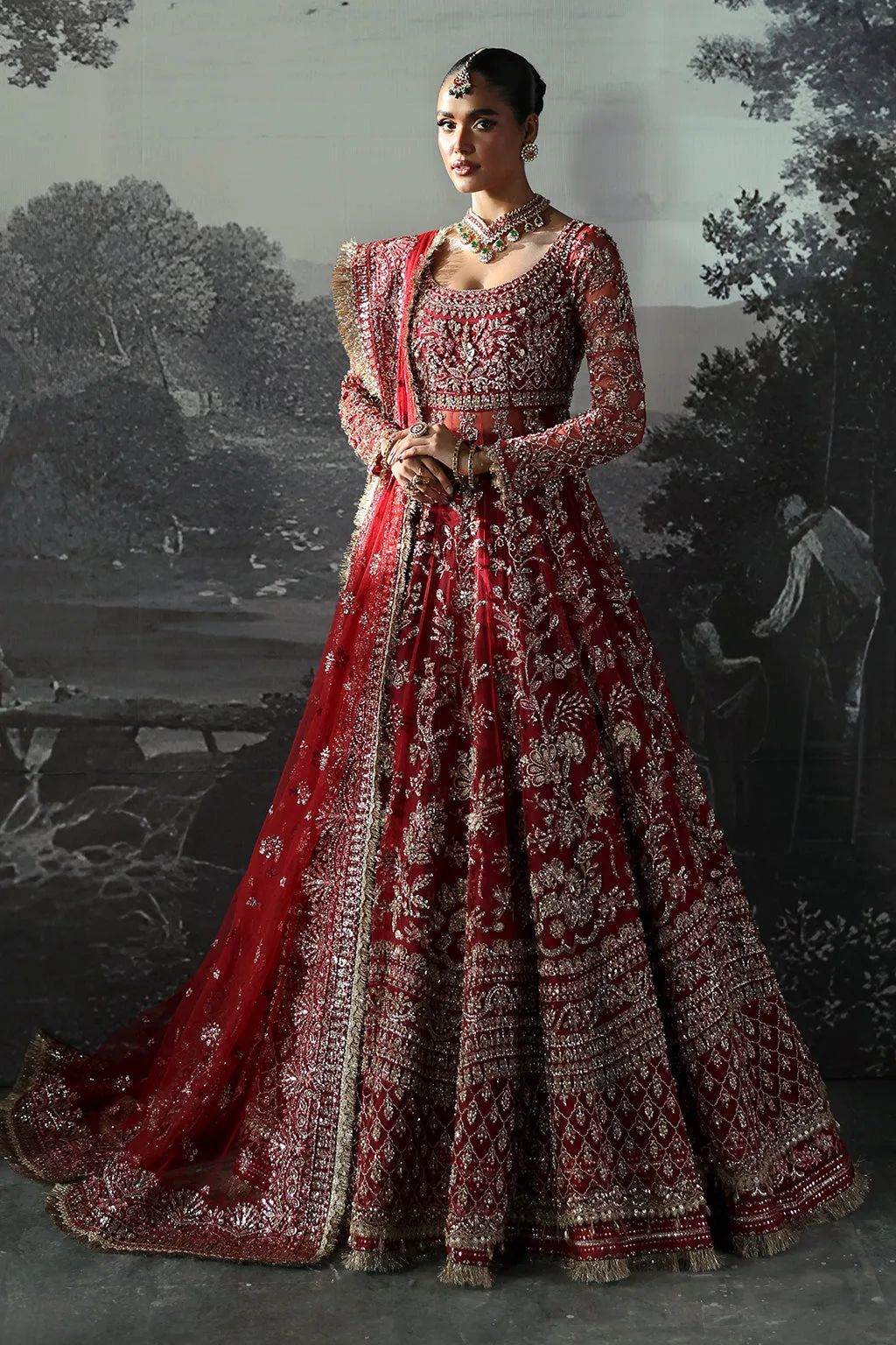 Red Pakistani Bridal Dress in Peshwas and Lehenga Style