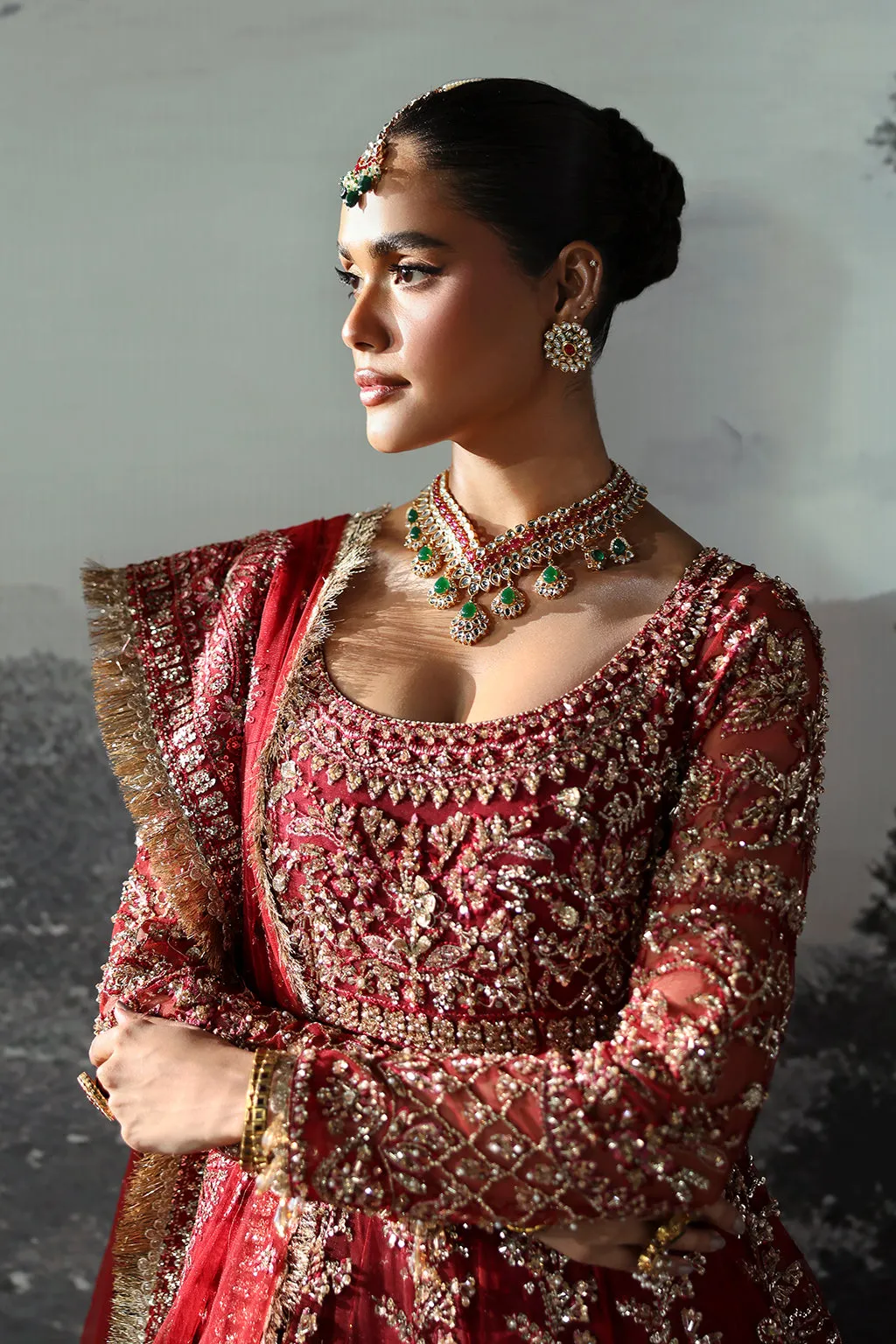 Red Pakistani Bridal Dress in Peshwas and Lehenga Style