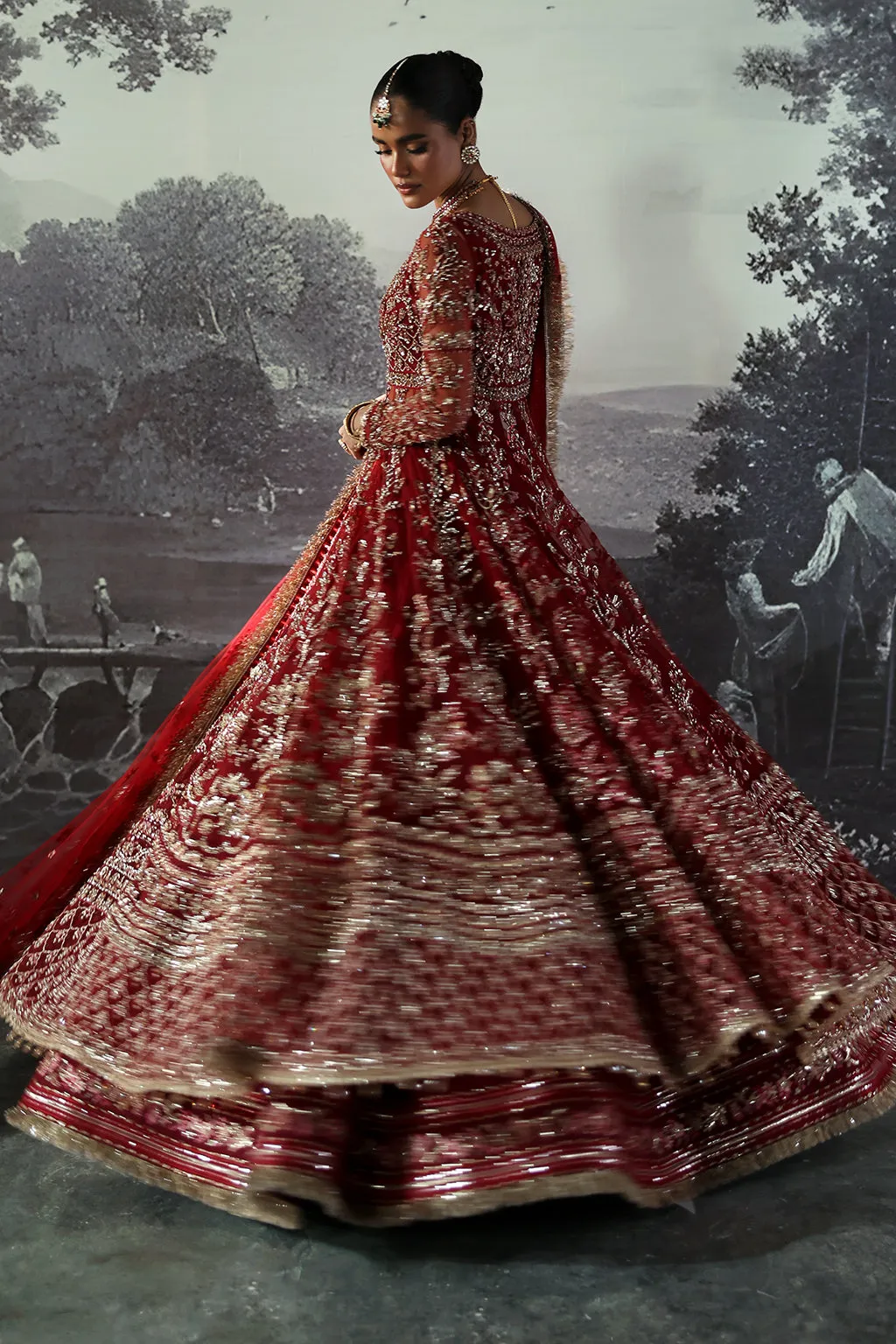 Red Pakistani Bridal Dress in Peshwas and Lehenga Style